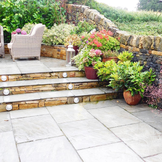 Indian Paving stoned garden area with raised steps