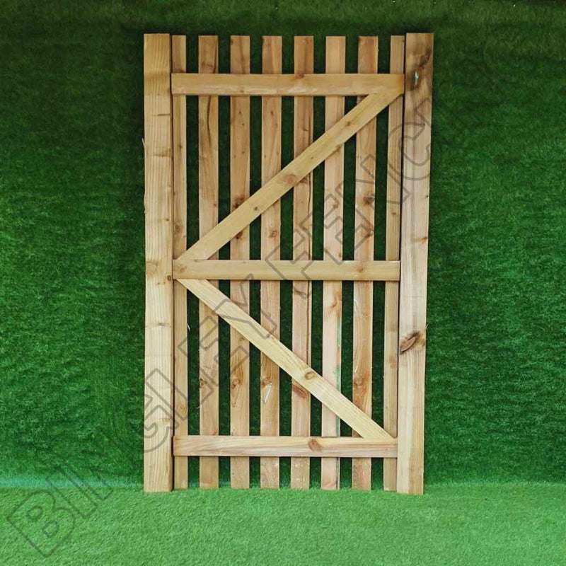 Load image into Gallery viewer, Introducing the Bingley Fencing Paling Gates Single Sided with 2" Gaps, available in Flat Top and Arched Top styles. Crafted from vertical wooden slats with diagonal bracing, these gates offer low maintenance and are presented against a lush green background for added charm. They perfectly embody effortless elegance, making them an ideal choice for simple installation in any outdoor setting.