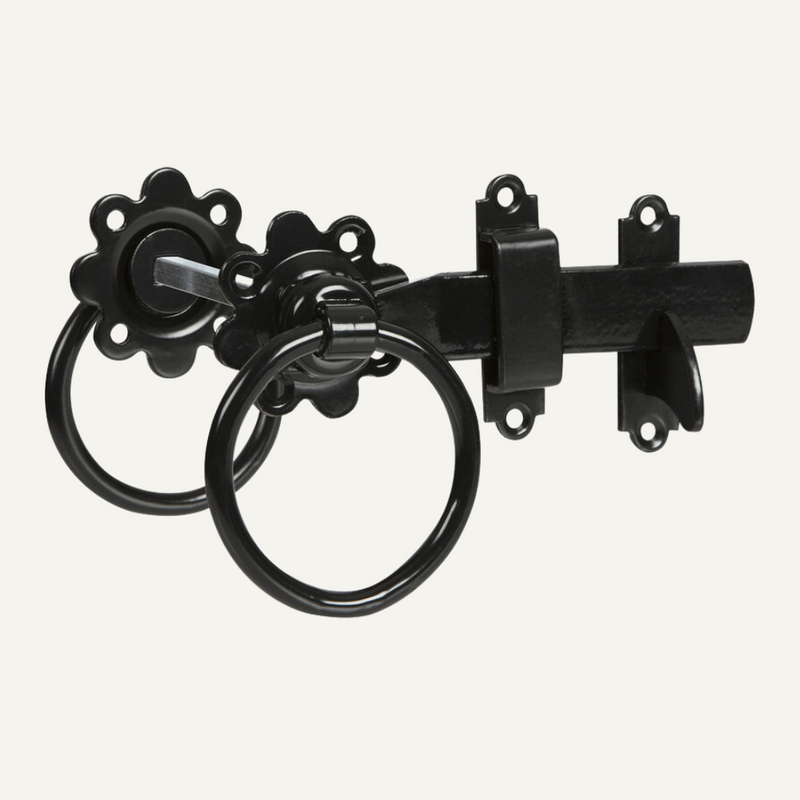 Load image into Gallery viewer, The Ring Gate Latch 6" from Henry Shaw, available in black or galvanised, features decorative flower-shaped mounting plates and two circular handles. This exquisite piece of ironmongery is beautifully showcased on a light background, emphasizing its elegant design and intricate details.