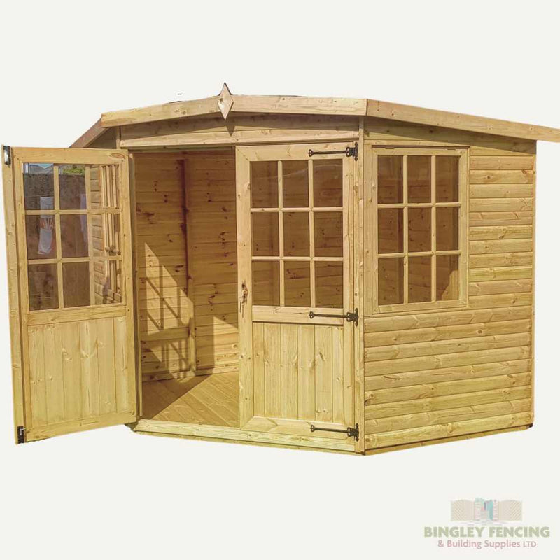 Load image into Gallery viewer, The Corner House - Summerhouse by Bingley Fencing is a wooden garden shed with a pentagonal roof, featuring two large glass windows on the front and an open glass-panel door on the left. Its custom-made interior showcases an inviting unfinished wood structure, ideal for capturing seasonal charm.