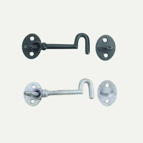 Two John George Cabin Hooks, one black and one silver, are displayed side by side on a white background. Each hook features an oval base with two screw holes, perfect for securing sheds or gates.