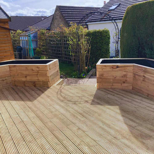 Garden decking area with two large custom wooden planters