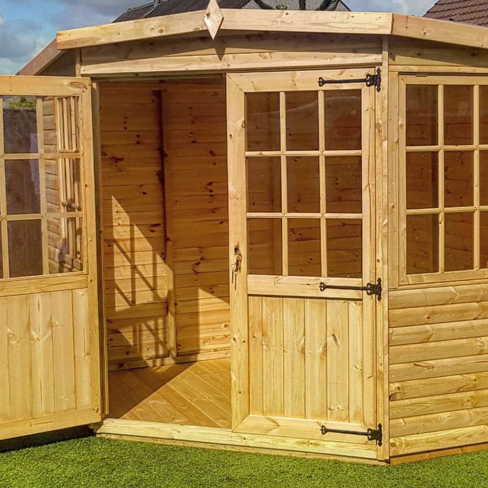 Large wooden summerhouse with georgian doors that are open.