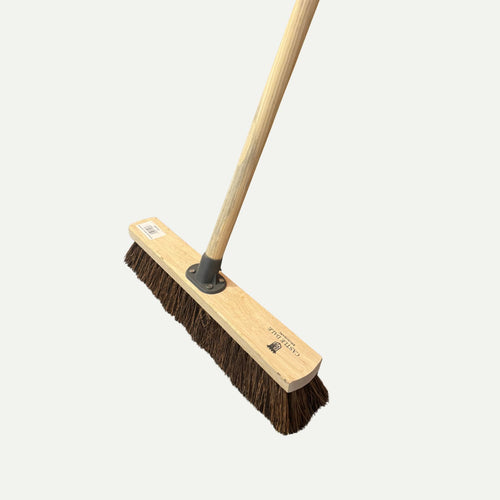 The Bingley Fencing Hard Bristle Sweeping Brush, featuring a wooden handle and dense brown bristles, is set against a plain white background.
