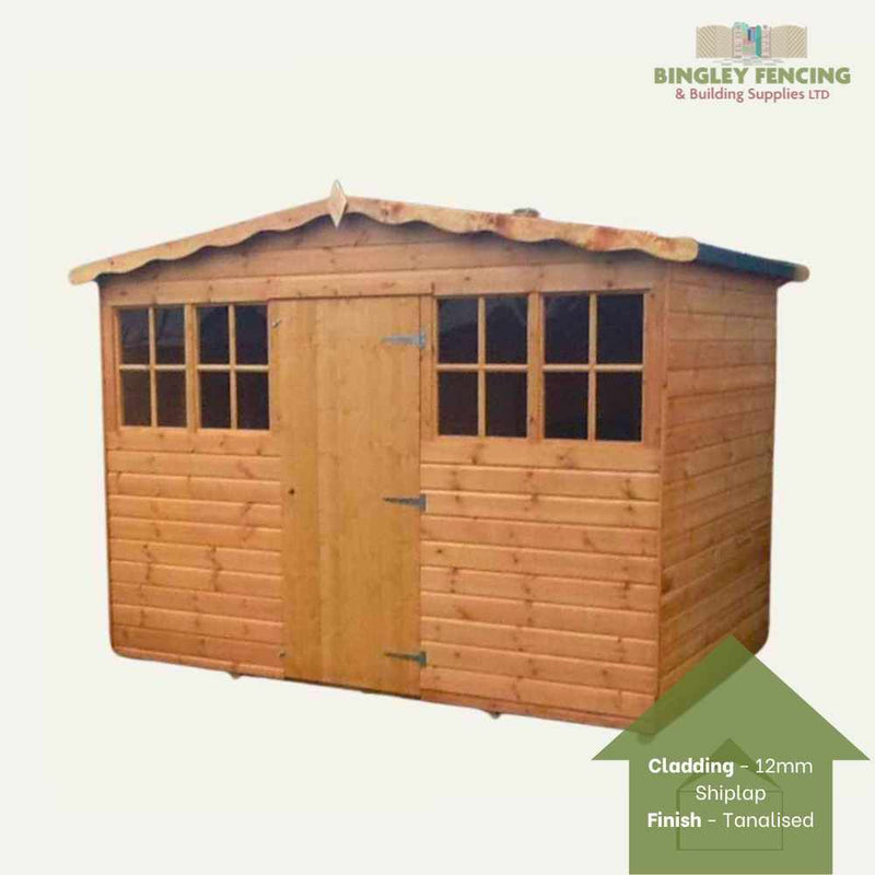 Load image into Gallery viewer, The Hobby House Shed by Bingley Fencing is a custom wooden garden shed, featuring large Georgian windows and a central door. It is designed with shiplap cladding and has a tanalised finish, with the elegant Bingley Fencing logo placed in the top right corner to highlight its craftsmanship.