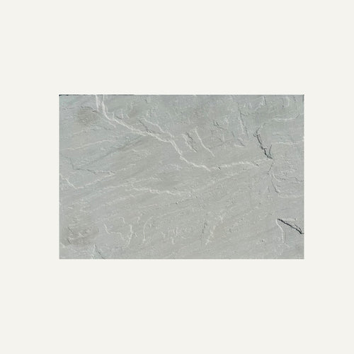 A Kandla Grey Indian Sandstone Individual Paving Slab from Bingley Fencing displays fine white veining and textured patterns, set against a plain off-white background.