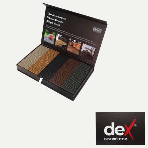 Open sample box of deX Classic Composite Decking Boards 3.6m – 4 Colours from Bingley Fencing, displaying a variety of wood-textured color options—including examples of composite and reversible decking. Promotional text and images are featured inside the lid, with the deX DISTRIBUTOR logo in the bottom right corner.