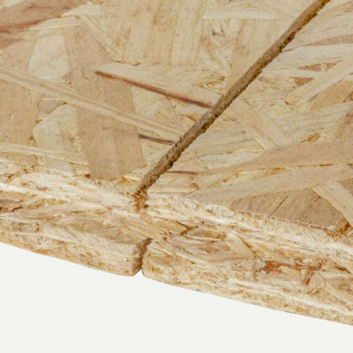 Close-up of a stack of Bingley Fencing 18mm OSB Tongue & Groove Flooring Sheets, ideal for load-bearing applications. The rough, layered texture reveals visible wood strands and natural color variations, with a cut edge in the foreground perfect for installations like OSB3 Flooring.