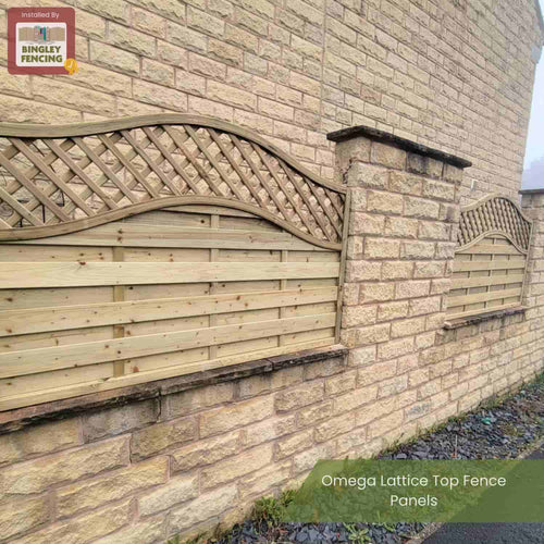 KDM Omega Lattice Top Fence Panels (OLT) are installed between stone pillars on a stone wall outside a building. The Bingley Fencing logo is in the top left corner with the text: Omega Lattice Top Fence Panels.