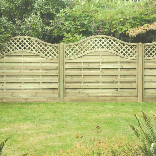 The KDM Omega Lattice Top Fence Panels (OLT) feature curved lattice tops and stylish timber construction, set before lush shrubs and trees with a neat grassy lawn in front—ideal for adding elegance to your garden boundaries.