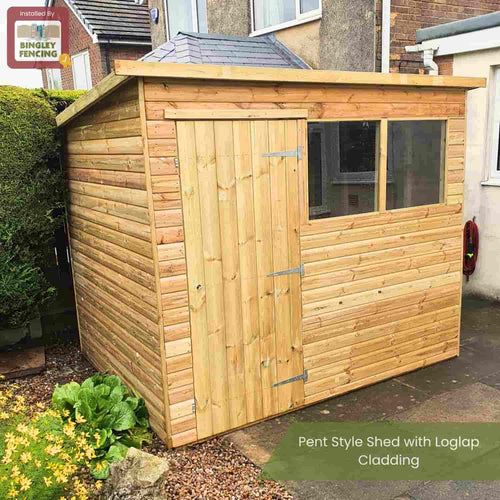 The Bingley Fencing Shed - Pent Roof features loglap cladding, a single door, and two rectangular windows, perfect for your garden setting beside a house and surrounded by greenery.