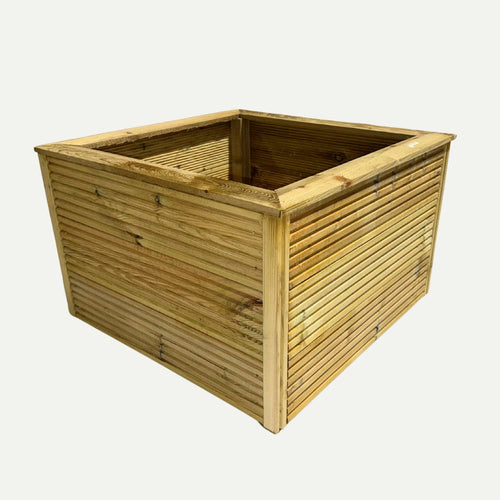 A large square garden planter from Bingley Fencing, featuring horizontal slats and a light natural finish, is expertly crafted from pressure treated timber for enhanced durability. Shown at an angle against a plain white background, this premium wooden planter is ideal for those seeking high-quality garden planters in West Yorkshire.