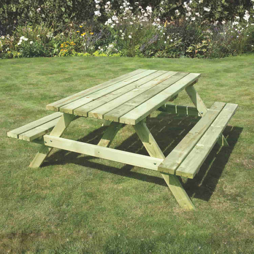 The KDM Standard A Frame Table 160cm x 180cm (SPB180) with attached benches is ideal for outdoor dining on your lawn, blending comfort and style among blooming flowers and greenery.