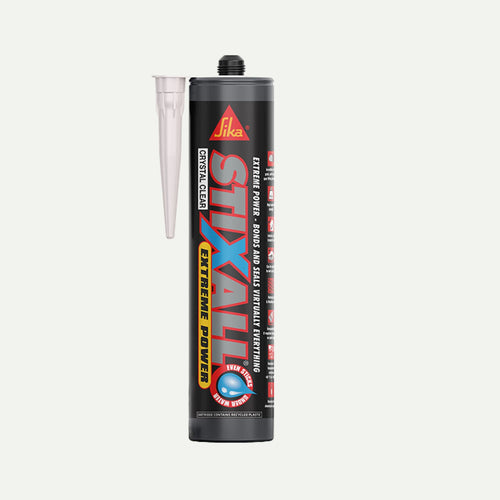 A white tube of Sika Stixall Extreme Power hybrid polymer adhesive with a detachable applicator nozzle.
