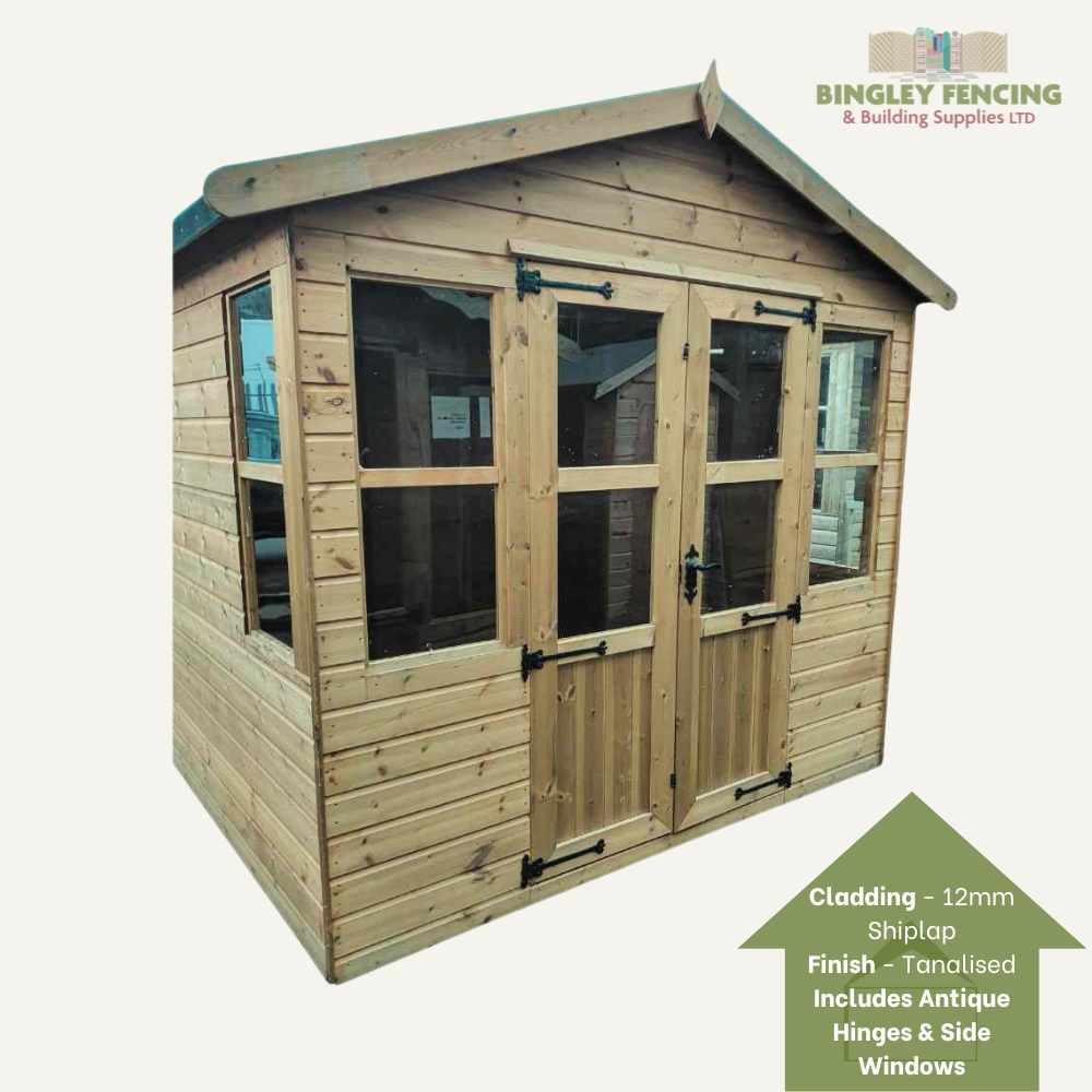 The Traditional Summerhouse from Bingley Fencing features a wooden garden shed design with glass double doors, side windows, and a charming verandah. It is constructed with 12mm shiplap cladding that boasts a tanalised finish, embellished by antique hinges. This product is made to order.