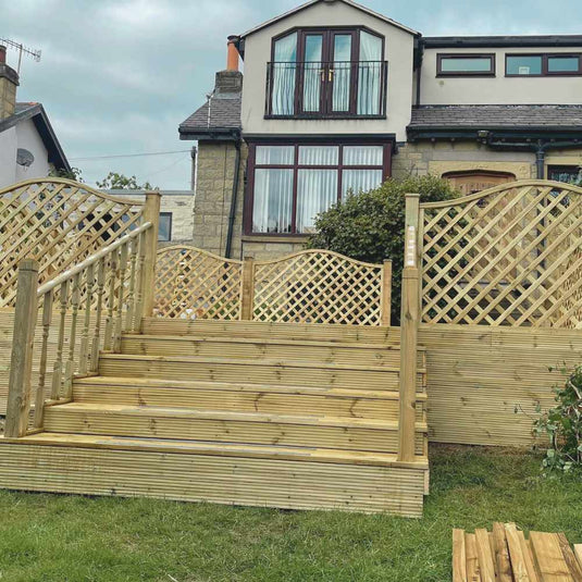 Wooden decking area with steps and privacy trellis.