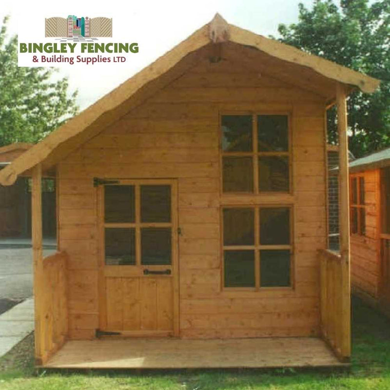 Load image into Gallery viewer, The Fantasia Kids Playhouse by Bingley Fencing captures the charm of sheds and playhouses with its compact wooden design featuring a peaked roof, door, and several windows. It stands on a simple lawn, treated with child-friendly preservatives, and showcases the Bingley Fencing logo in the upper left corner.