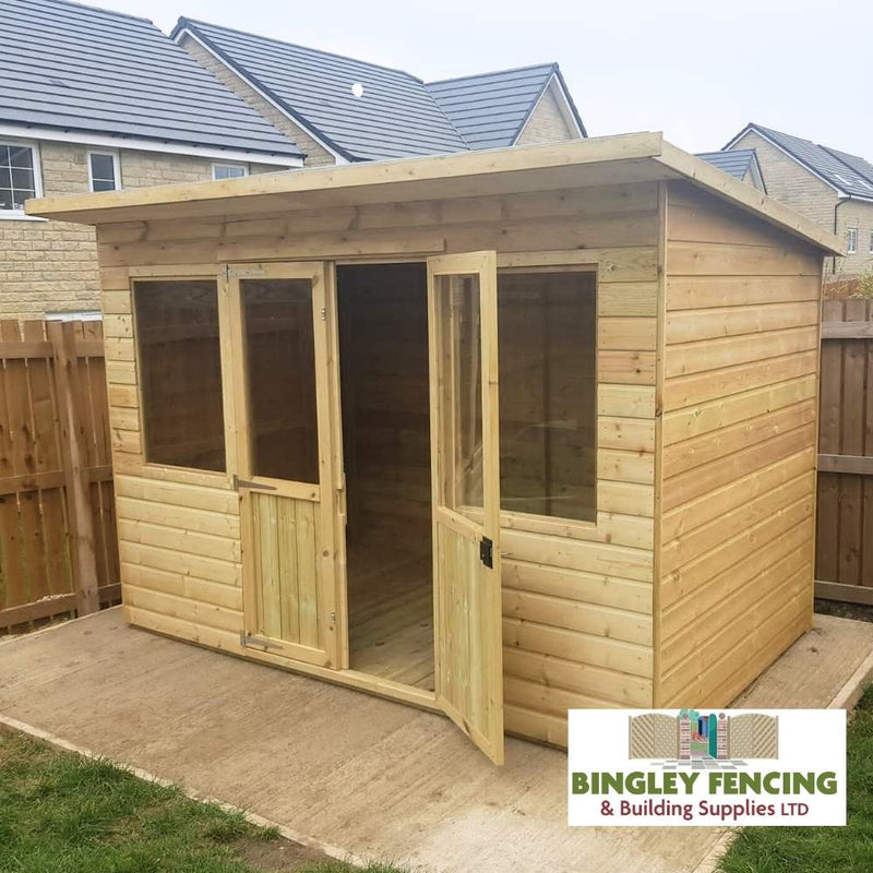 Load image into Gallery viewer, A Pent Summerhouse by Bingley Fencing, featuring large glass windows and a door, is positioned on a concrete base in a fenced backyard with neighboring houses in view. The summerhouse is topped with a flat roof proudly displaying the Bingley Fencing & Building Supplies LTD logo. Take advantage of flexible payment plan options to make it yours.