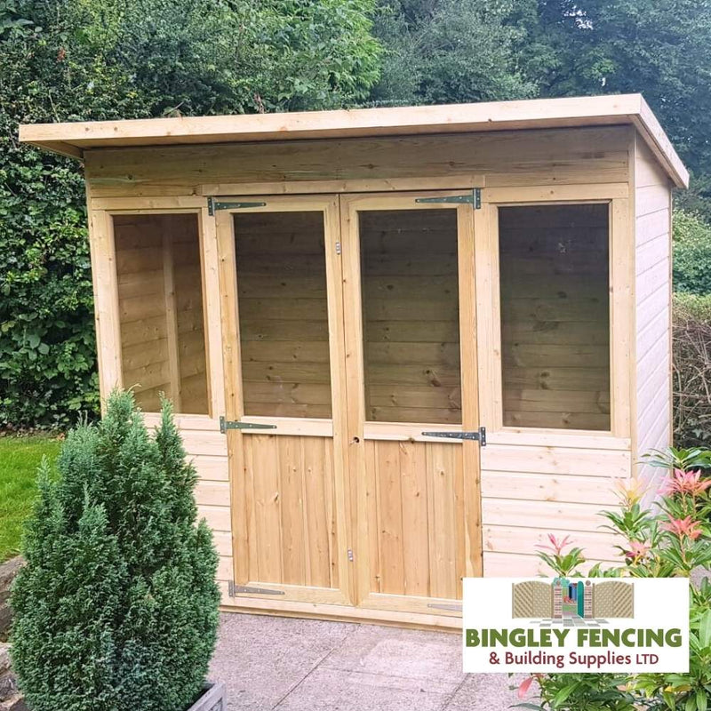 Load image into Gallery viewer, The Pent Summerhouse by Bingley Fencing showcases two glass-paneled doors and a flat roof, situated on a stone patio. Surrounded by lush greenery, it exudes custom elegance. The logo for Bingley Fencing & Building Supplies LTD is positioned at the bottom right, symbolizing quality and bespoke craftsmanship.