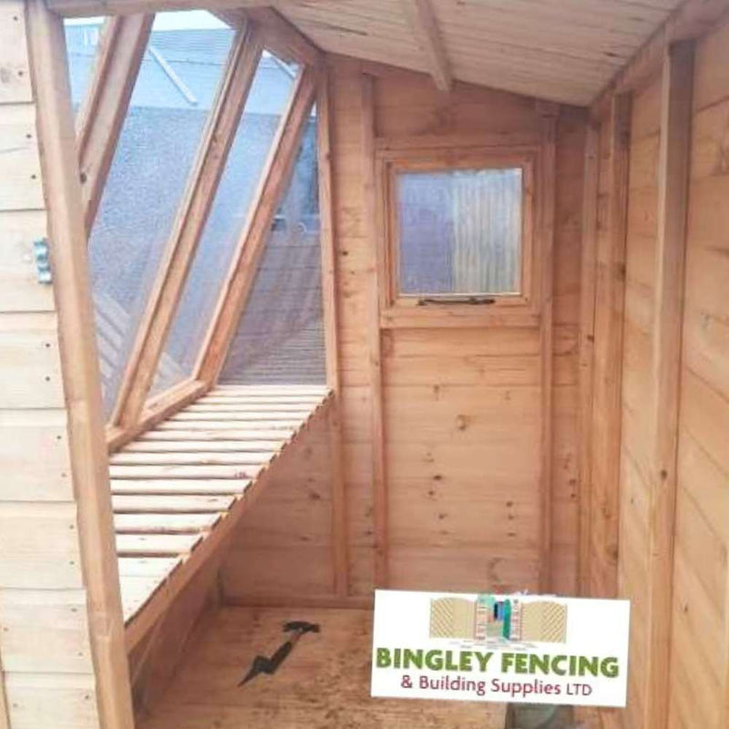 Load image into Gallery viewer, A wooden shed interior with skylights and a side window is ideal for gardeners. Made of light-colored wood, it can be custom-made. The logo reads Bingley Fencing. Product: The Potting Shed - Gardeners Choice.