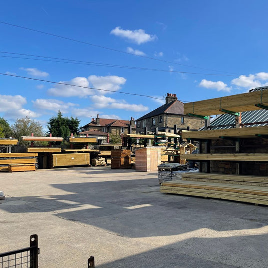 External view of bingley fencing timber yard showing racks of timber.