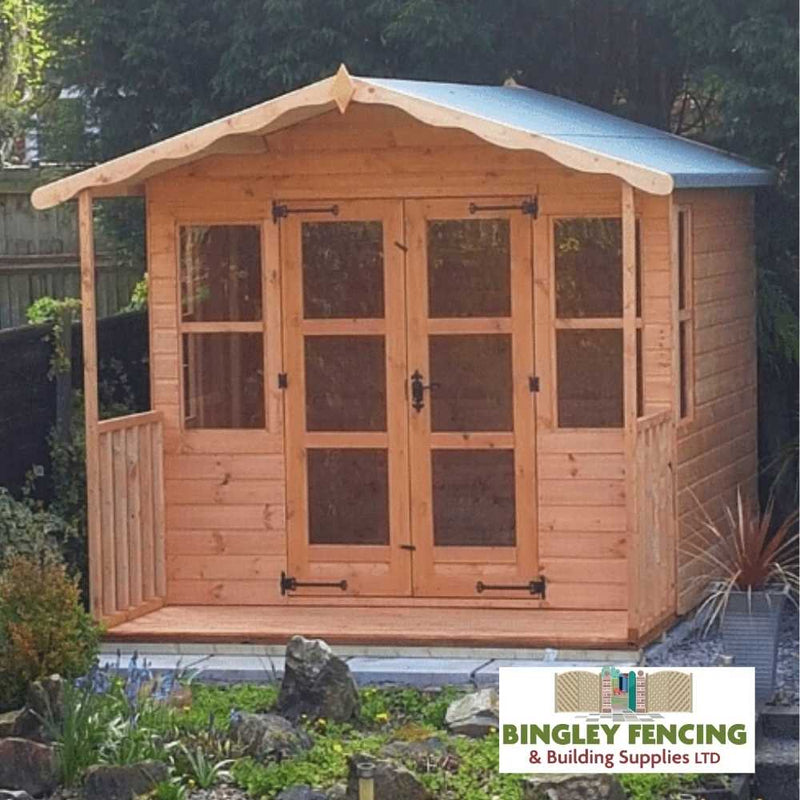 Load image into Gallery viewer, A Traditional Summerhouse, featuring wooden construction and glass doors and windows, is surrounded by a lush garden, perfectly embodying the essence of a classic retreat. The Bingley Fencing brand logo in the bottom right corner adds an authentic touch.