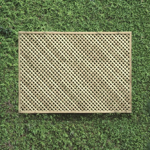 Load image into Gallery viewer, A KDM Trellis - Privacy Lattice - Rectangle 120 x 180cm is mounted on a lush green wall adorned with foliage. The lattice's crisscross pattern forms a grid-like effect against the vibrant leaves, enhancing the garden's natural beauty while providing privacy.