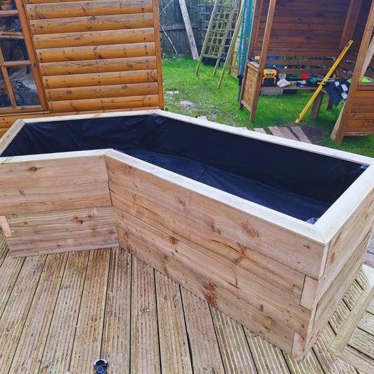 Wooden planter with black lining