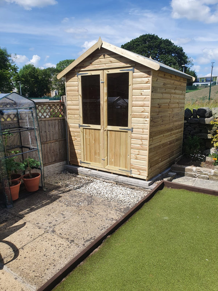 Timber garden shed installed on a garden patio