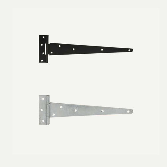 Two Henry Shaw Medium T Hinges, one powder-coated black and the other in galvanized silver. Each hinge features a rectangular plate with multiple screw holes and a tapered arm extending to the right. Perfect for gate ironmongery, they create a striking contrast against the light gray background.