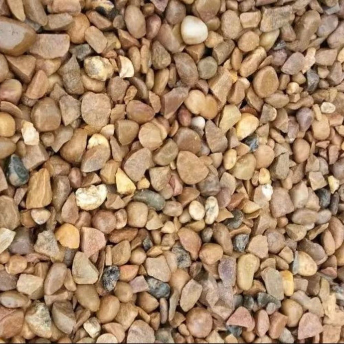 Close-up of small pebbles in various earthy tones