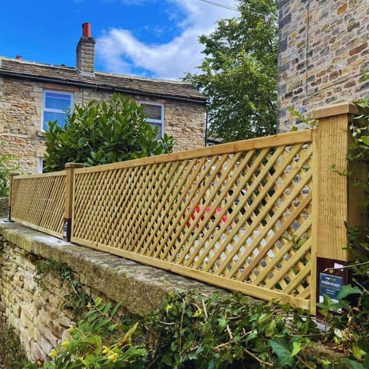 Wall top trellis installed on a stone wall.