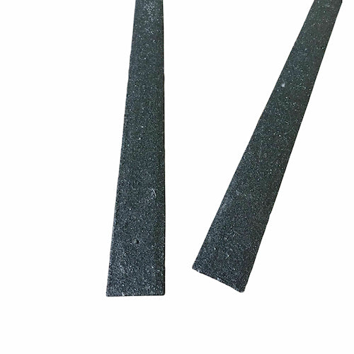 Two black, rectangular rubber strips are shown on a white background. One strip is cut at an angle at the end, while the other is cut straight across.