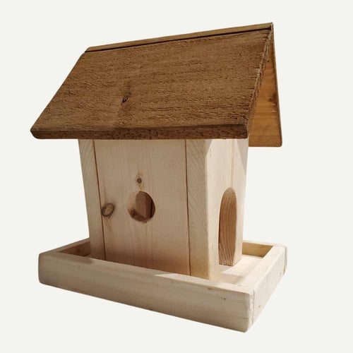 The Bingley Fencing Bird Feeder - Bird House features a handmade design with a slanted roof and two circular openings on a rectangular base, highlighted against a plain white background.