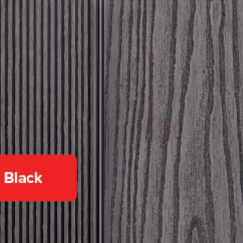 Close-up of deX Composite Decking Step Boards by deX in Black, featuring two surface textures: vertical grooves on the left for a grooved finish and wood grain on the right. A red label in the corner displays “Black.”.