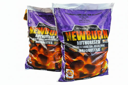 Two bags of Bingley Fencing's Newburn 25KG Smokeless Coal - Premium, featuring a purple and orange design, are labeled as authorized for use in smoke-controlled areas. These clean-burning briquettes are ready to burn, providing a low-emission alternative to traditional options.