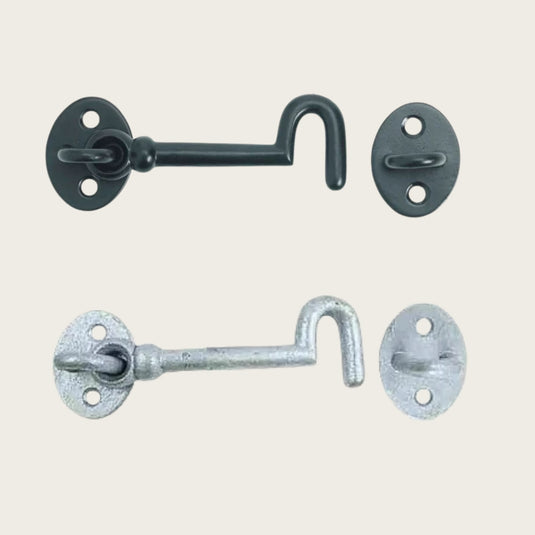 Two  metal cabin hooks. One in galvanised finish and one in black.
