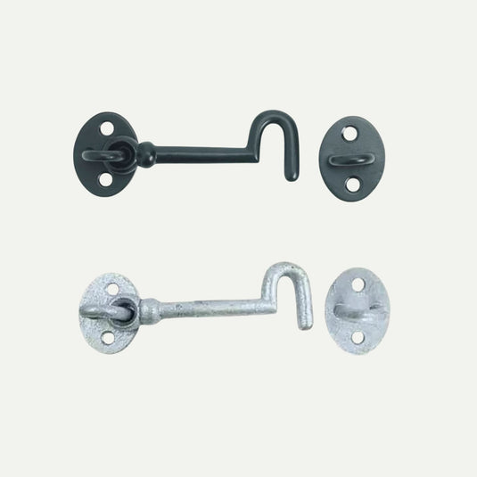 Two John George Cabin Hooks, one black and one silver, are displayed side by side on a white background. Each hook features an oval base with two screw holes, perfect for securing sheds or gates.