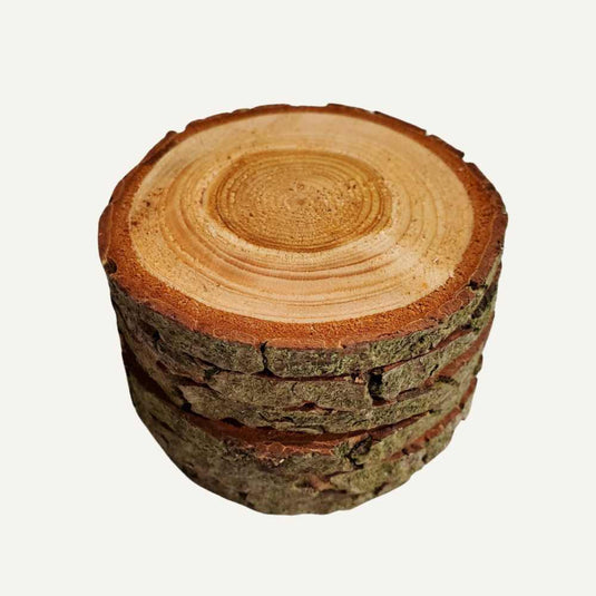 Bingley Fencing Log Roll Coasters feature rustic live edge designs with visible tree rings and rough bark edges, displayed on a plain white background.