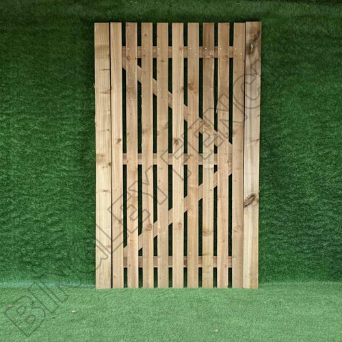 A Bingley Fencing "Paling Gates Single Sided 1\" Gaps- Flat Top & Arched Top," designed for gate installation, features vertical slats with a diagonal support beam and stands against a green artificial grass background. Expertly crafted to minimize privacy gaps commonly found in paling fence gates.