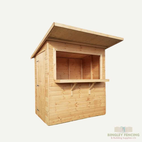 This Garden Bar from Bingley Fencing is designed with a spacious serving window and a slanted roof, crafted from light-colored wood. It prominently displays the company logo, Bingley Fencing & Building Supplies Ltd, in the bottom right corner, making it an excellent addition for creating a charming outdoor entertainment area.