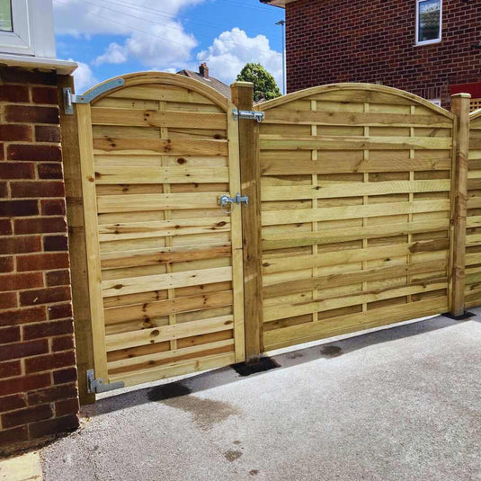 Wooden garden gate and fence featuring horizontal slats and steel ironmongery