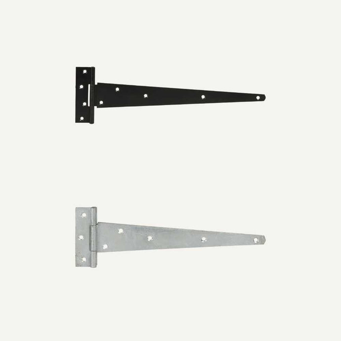 Against a plain background, two medium T hinges from Henry Shaw are featured. The top hinge is finished with a powder-coated black surface, ideal for gate ironmongery, while the bottom hinge boasts a silver appearance. Both Medium T Hinges - 12