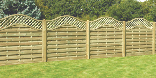 Curved top fence panels with trellis installed in a garden