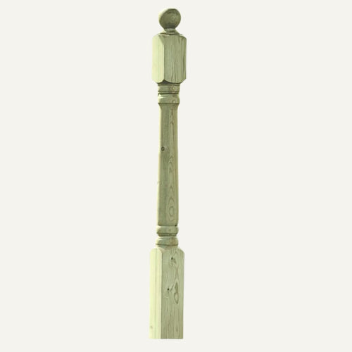 Wooden baluster with decorative top on a white background