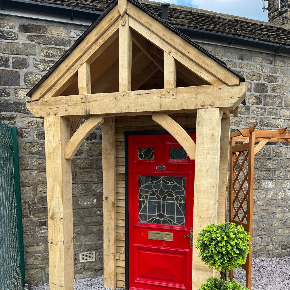 Feature designed oak entrance porch installed at display area in bingley fencing