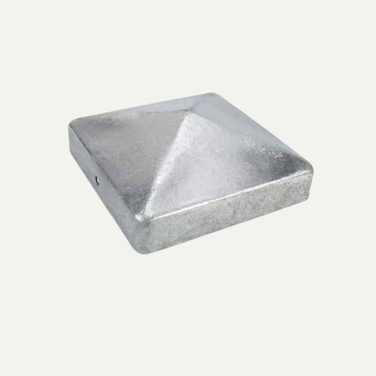 A metallic, silver-colored square cap with a pyramid-shaped top—characteristic of Bingley Fencing’s Galvanised Steel Fence Post Caps (Various Sizes)—is pictured at an angle against a plain white background.