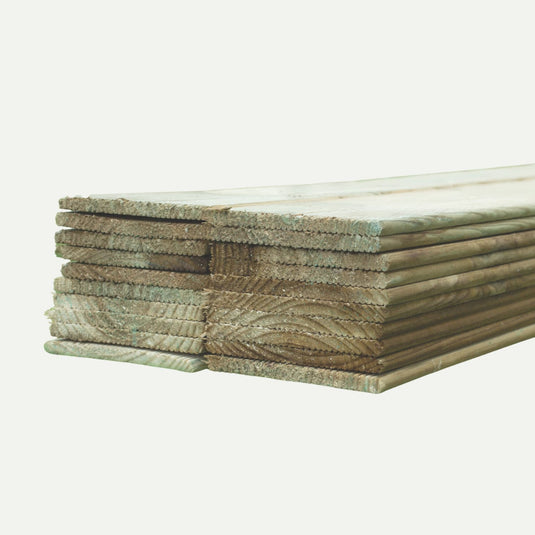 KDM Replacement Slats - European Fencing: Neatly stacked, light brown, pressure-treated wooden planks with grooved edges—ideal for fence panels or repairs. Perfect fencing material for West Yorkshire projects.