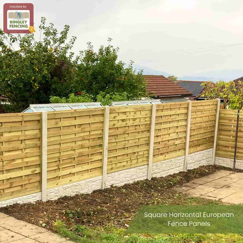 A garden features KDM Square Horizontal Fence Panels (SH) made of solid timber slats and concrete posts. Trees and rooftops appear in the background. Text on image: “Square Horizontal European Fence Panels.”.