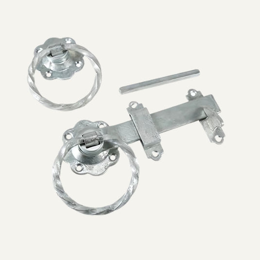 Metal door handles and lock mechanism on a white background